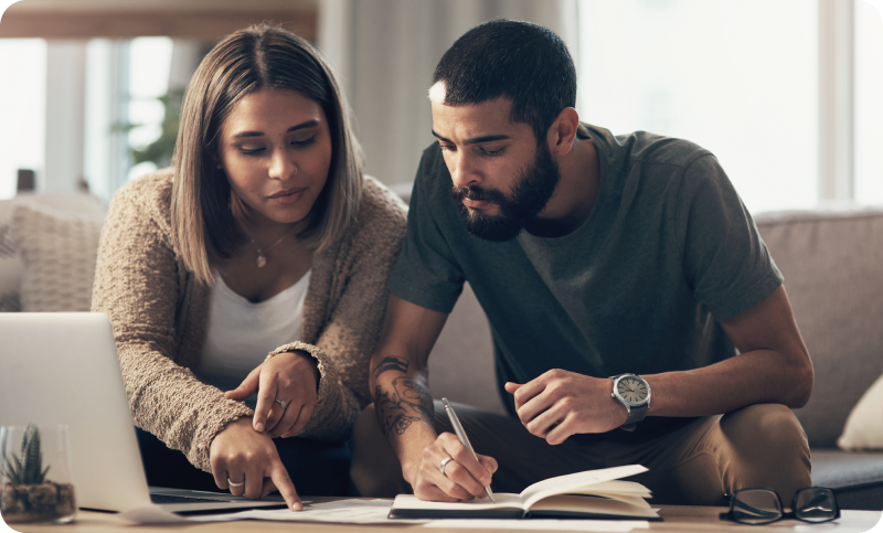 couple reviewing documents on the couch