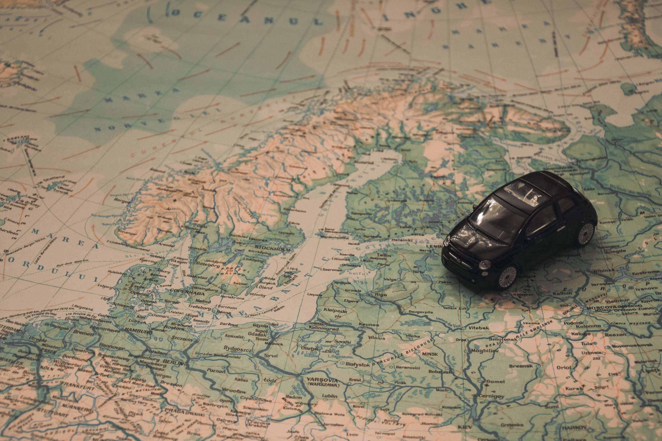 small car sitting on a world map