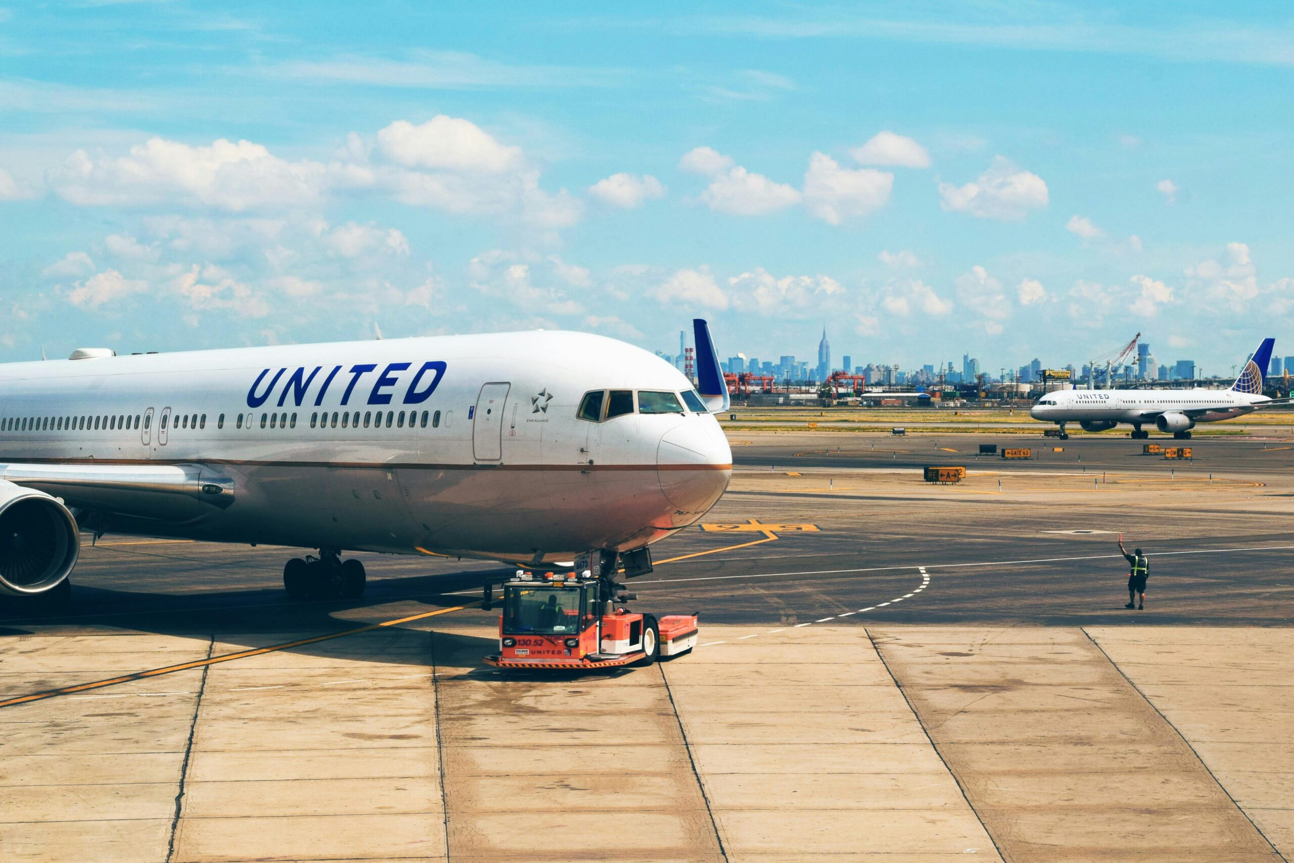 airplane being pulled to gate